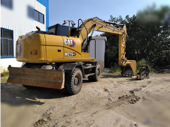 מחפר גלגלים CATERPILLAR M315