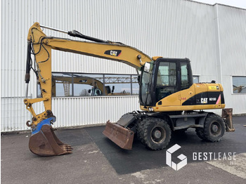 מחפר גלגלים CATERPILLAR M313D