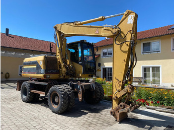 מחפר גלגלים CATERPILLAR M312