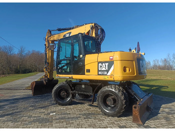 מחפר גלגלים CATERPILLAR M313D