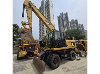 מחפר גלגלים CATERPILLAR M320