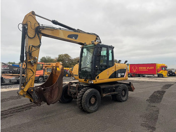 מחפר גלגלים CATERPILLAR M313D