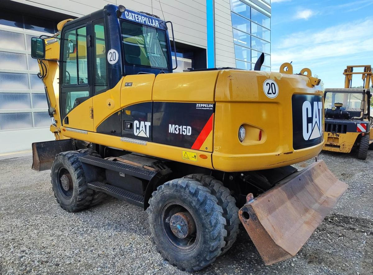 Caterpillar M315D - מחפר גלגלים: תמונה 1 Caterpillar M315D - מחפר גלגלים: תמונה 1