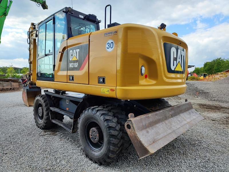 Caterpillar M316F - מחפר גלגלים: תמונה 1 Caterpillar M316F - מחפר גלגלים: תמונה 1