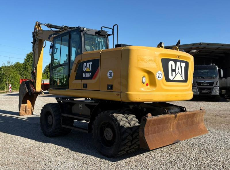 Caterpillar M318F - מחפר גלגלים: תמונה 1 Caterpillar M318F - מחפר גלגלים: תמונה 1