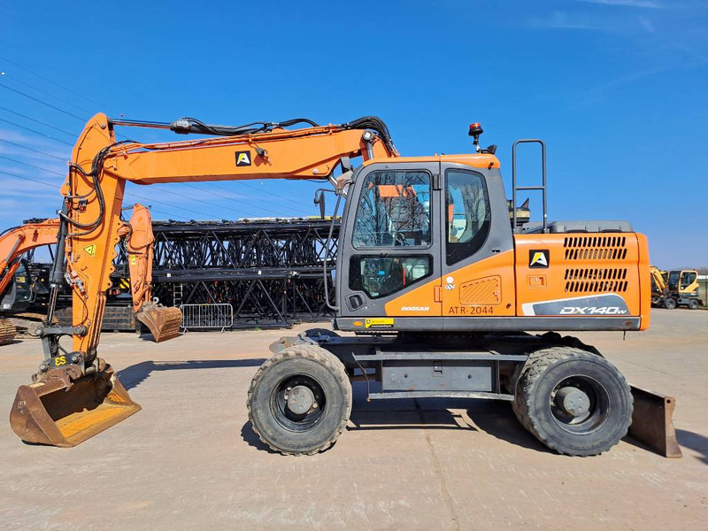 Doosan DX140W-5 - מחפר גלגלים: תמונה 1 Doosan DX140W-5 - מחפר גלגלים: תמונה 1