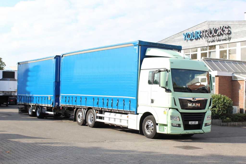 MAN TGX 26.460 Retarder Jumbo-Zug 120M3 Durchlade - משאית וילונות צד: תמונה 1 MAN TGX 26.460 Retarder Jumbo-Zug 120M3 Durchlade - משאית וילונות צד: תמונה 1