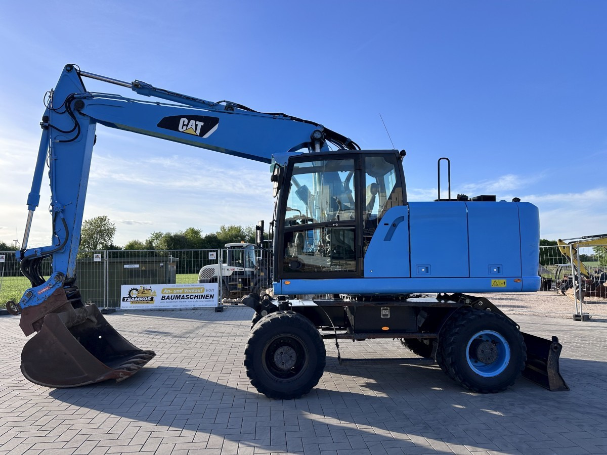 CATERPILLAR M 318 F Oil Quick OQ 65 Deutsche Maschine Top ! - מחפר גלגלים: תמונה 1 CATERPILLAR M 318 F Oil Quick OQ 65 Deutsche Maschine Top ! - מחפר גלגלים: תמונה 1