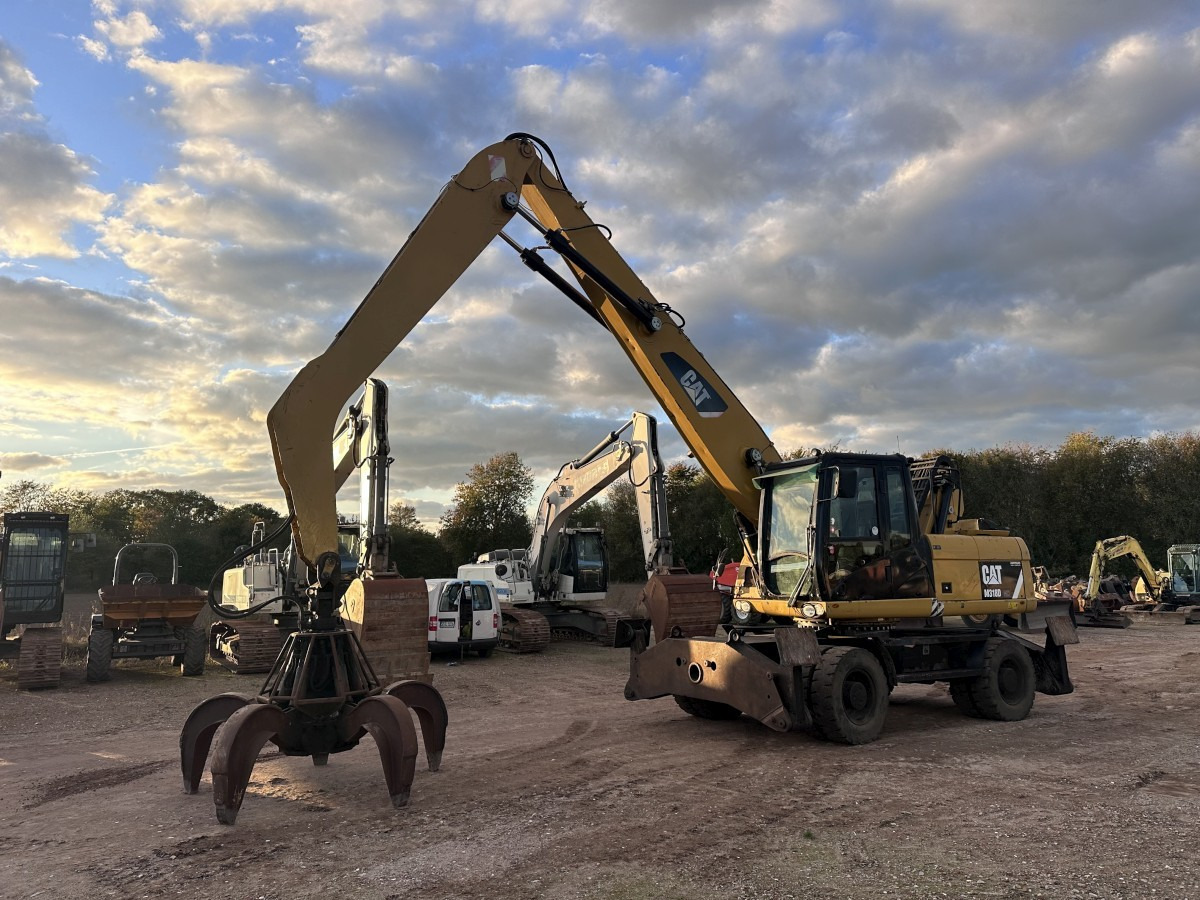 CATERPILLAR M 318 MH mit Greifer Kein 3022 3026 320 322 - מחפר גלגלים: תמונה 1 CATERPILLAR M 318 MH mit Greifer Kein 3022 3026 320 322 - מחפר גלגלים: תמונה 1