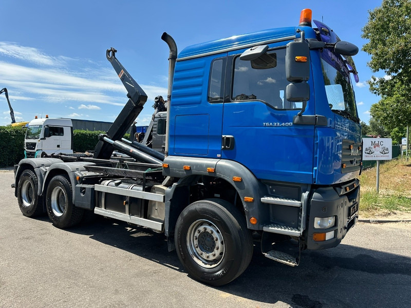 MAN TGA 33.400 6X4 HOOKLIFT AJK NHS20-4930mm - WB 3m60 - MANUAL ZF - STEEL SPRING / BLATT - BIG AXLES / AP ACHSEN - משאית הרמת וו: תמונה 1 MAN TGA 33.400 6X4 HOOKLIFT AJK NHS20-4930mm - WB 3m60 - MANUAL ZF - STEEL SPRING / BLATT - BIG AXLES / AP ACHSEN - משאית הרמת וו: תמונה 1