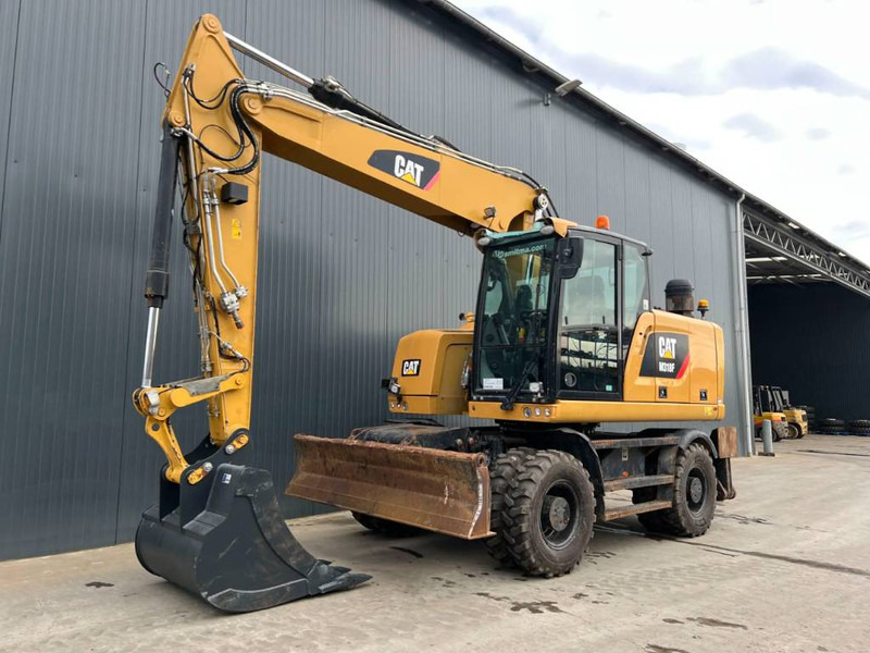 Cat M318F - מחפר גלגלים: תמונה 1 Cat M318F - מחפר גלגלים: תמונה 1