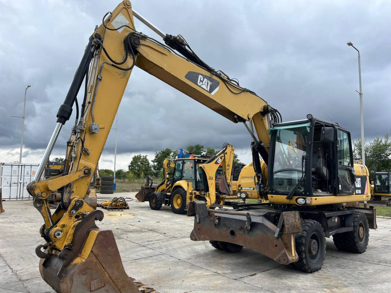 CAT M316D - מחפר גלגלים: תמונה 1 CAT M316D - מחפר גלגלים: תמונה 1