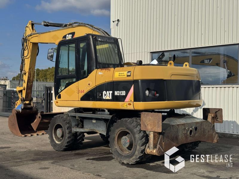Caterpillar M313D - מחפר גלגלים: תמונה 2 Caterpillar M313D - מחפר גלגלים: תמונה 2