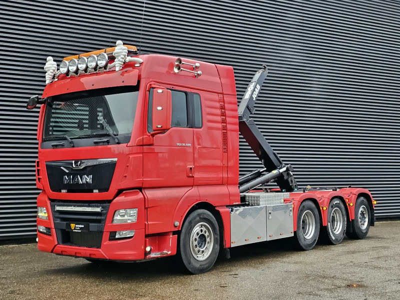 MAN TGX 35.500 / 8x4-4 / HOOKLIFT / ABROLL-KIPPER - משאית הרמת וו: תמונה 1 MAN TGX 35.500 / 8x4-4 / HOOKLIFT / ABROLL-KIPPER - משאית הרמת וו: תמונה 1
