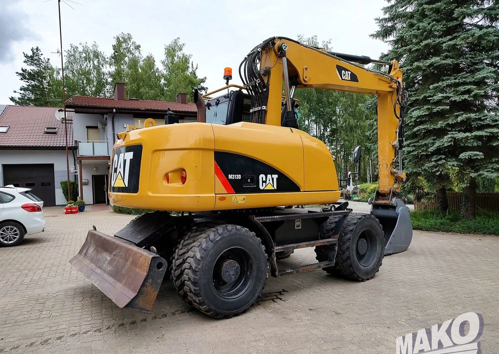Caterpillar M313D - מחפר גלגלים: תמונה 4 Caterpillar M313D - מחפר גלגלים: תמונה 4