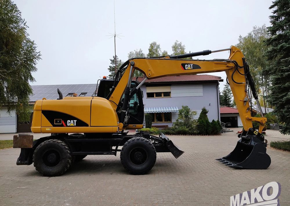 Caterpillar M313D - מחפר גלגלים: תמונה 5 Caterpillar M313D - מחפר גלגלים: תמונה 5