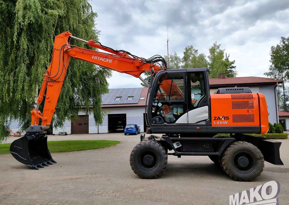 Hitachi ZX 140 - מחפר גלגלים: תמונה 1 Hitachi ZX 140 - מחפר גלגלים: תמונה 1