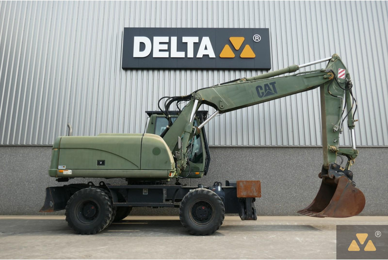 Caterpillar M318C Ex-army - מחפר גלגלים: תמונה 2 Caterpillar M318C Ex-army - מחפר גלגלים: תמונה 2
