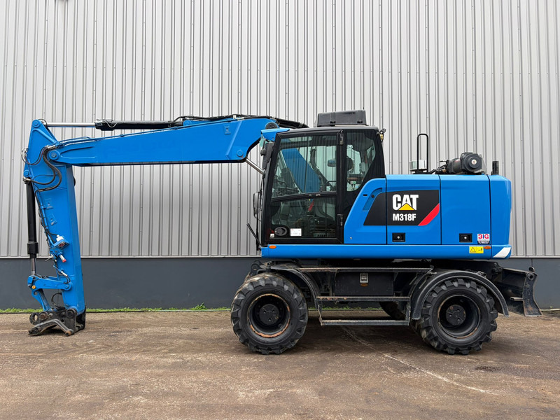 Caterpillar M318F - מחפר גלגלים: תמונה 1 Caterpillar M318F - מחפר גלגלים: תמונה 1