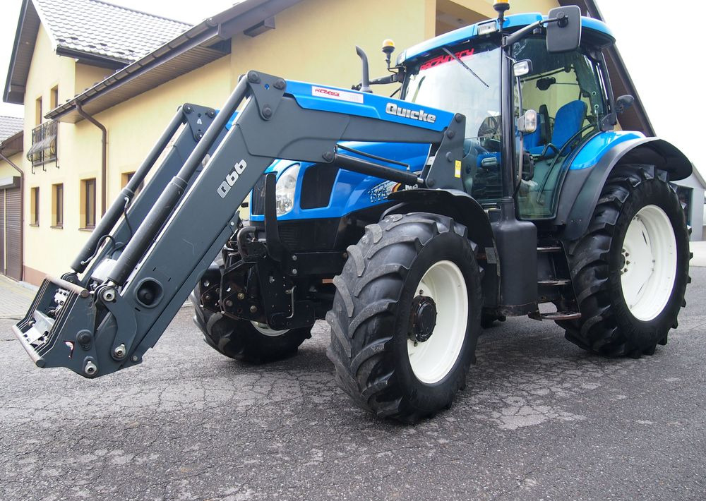 Ciągnik New Holland NH TS125A 6 cylindrów 2004 Ciągnik rolniczy New Holland TS125A - טרקטור חקלאי: תמונה 1 Ciągnik New Holland NH TS125A 6 cylindrów 2004 Ciągnik rolniczy New Holland TS125A - טרקטור חקלאי: תמונה 1