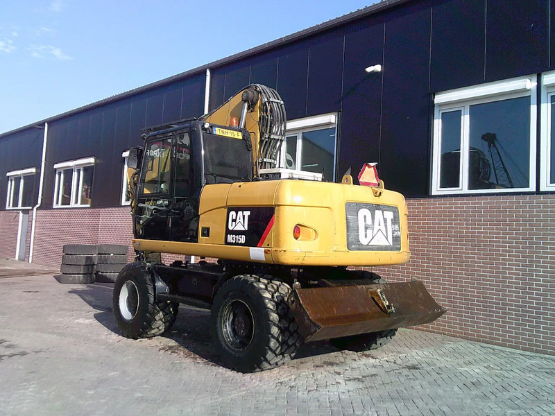 Caterpillar M315D - מחפר גלגלים: תמונה 2 Caterpillar M315D - מחפר גלגלים: תמונה 2