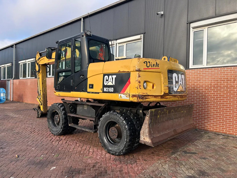 Caterpillar M316D - מחפר גלגלים: תמונה 4 Caterpillar M316D - מחפר גלגלים: תמונה 4