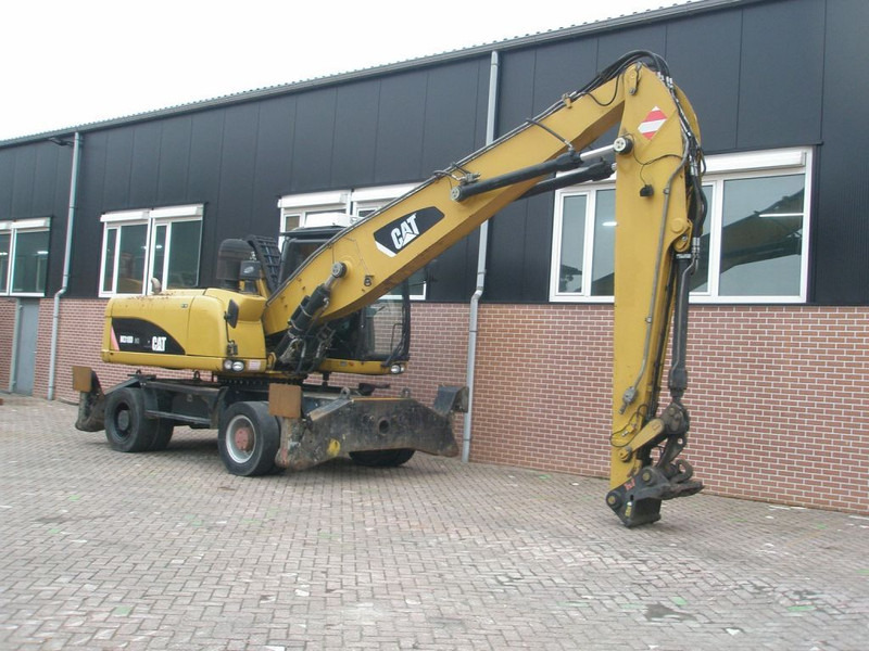 Caterpillar M318D - מחפר גלגלים: תמונה 3 Caterpillar M318D - מחפר גלגלים: תמונה 3
