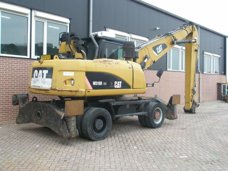 Caterpillar M318D - מחפר גלגלים: תמונה 4 Caterpillar M318D - מחפר גלגלים: תמונה 4