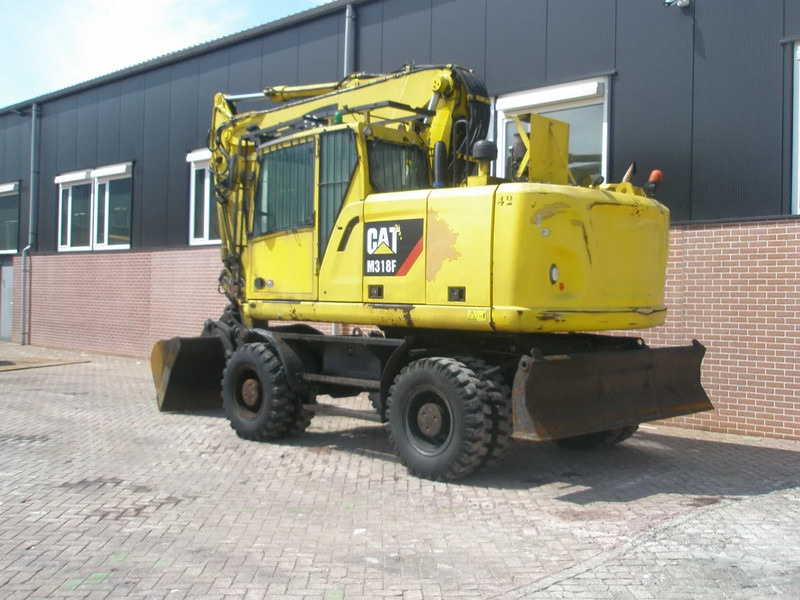 Caterpillar M318F - מחפר גלגלים: תמונה 2 Caterpillar M318F - מחפר גלגלים: תמונה 2