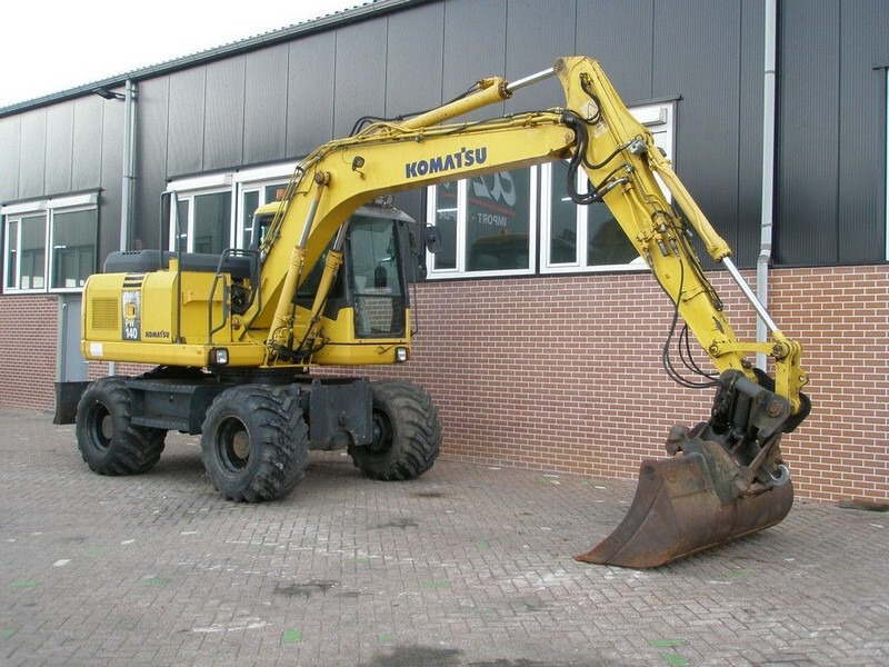 Komatsu PW140-7 - מחפר גלגלים: תמונה 3 Komatsu PW140-7 - מחפר גלגלים: תמונה 3