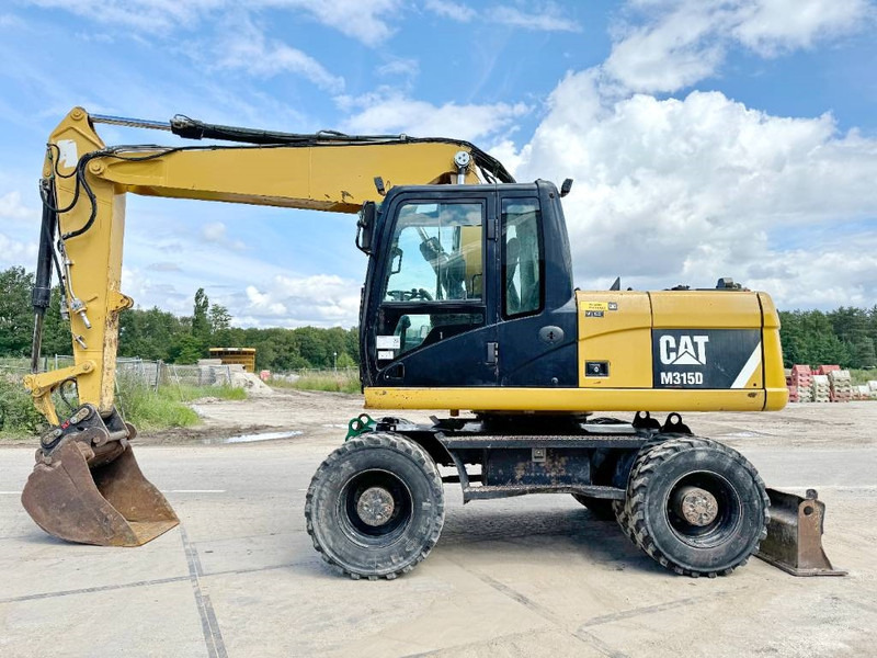 Cat M315D - Triple Boom / Quick Coupler - מחפר גלגלים: תמונה 1 Cat M315D - Triple Boom / Quick Coupler - מחפר גלגלים: תמונה 1
