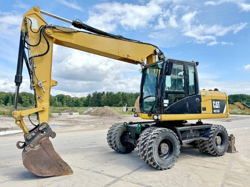 Cat M315D - Triple Boom / Quick Coupler - מחפר גלגלים: תמונה 2 Cat M315D - Triple Boom / Quick Coupler - מחפר גלגלים: תמונה 2