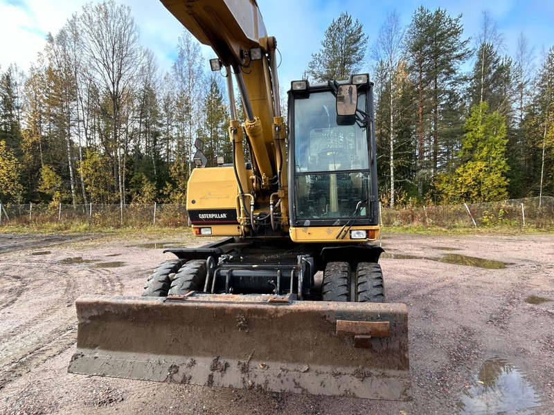Caterpillar M312 Engcon EC20 tiltrotator - מחפר גלגלים: תמונה 3 Caterpillar M312 Engcon EC20 tiltrotator - מחפר גלגלים: תמונה 3