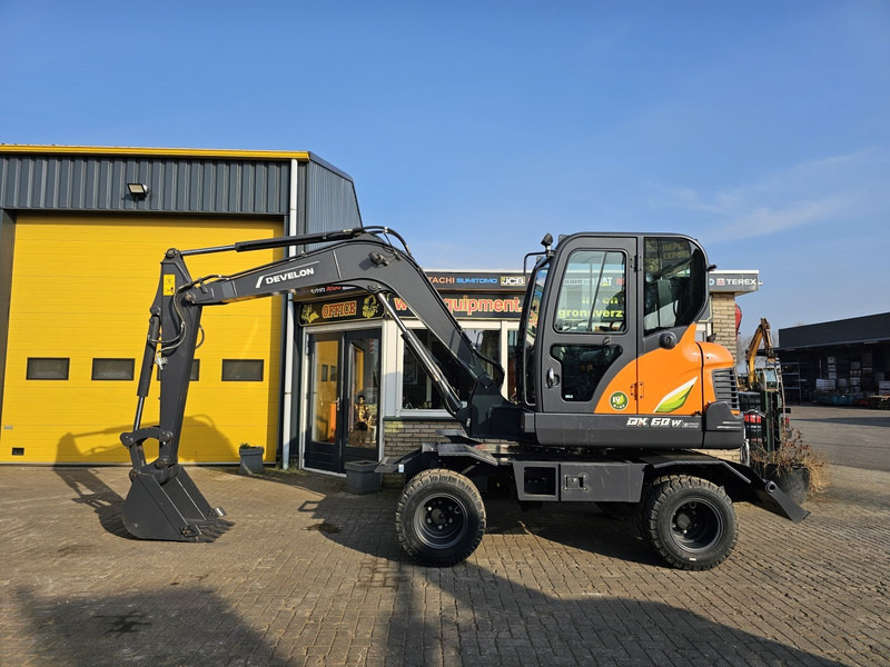 Develon DX60WN ECO-1 - מחפר גלגלים: תמונה 1 Develon DX60WN ECO-1 - מחפר גלגלים: תמונה 1