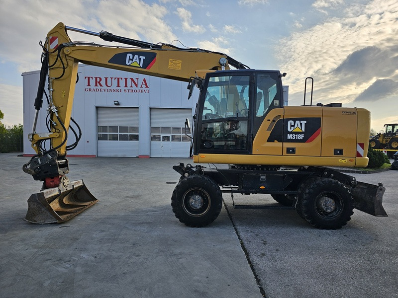 CATERPILLAR M318F - מחפר גלגלים: תמונה 1 CATERPILLAR M318F - מחפר גלגלים: תמונה 1
