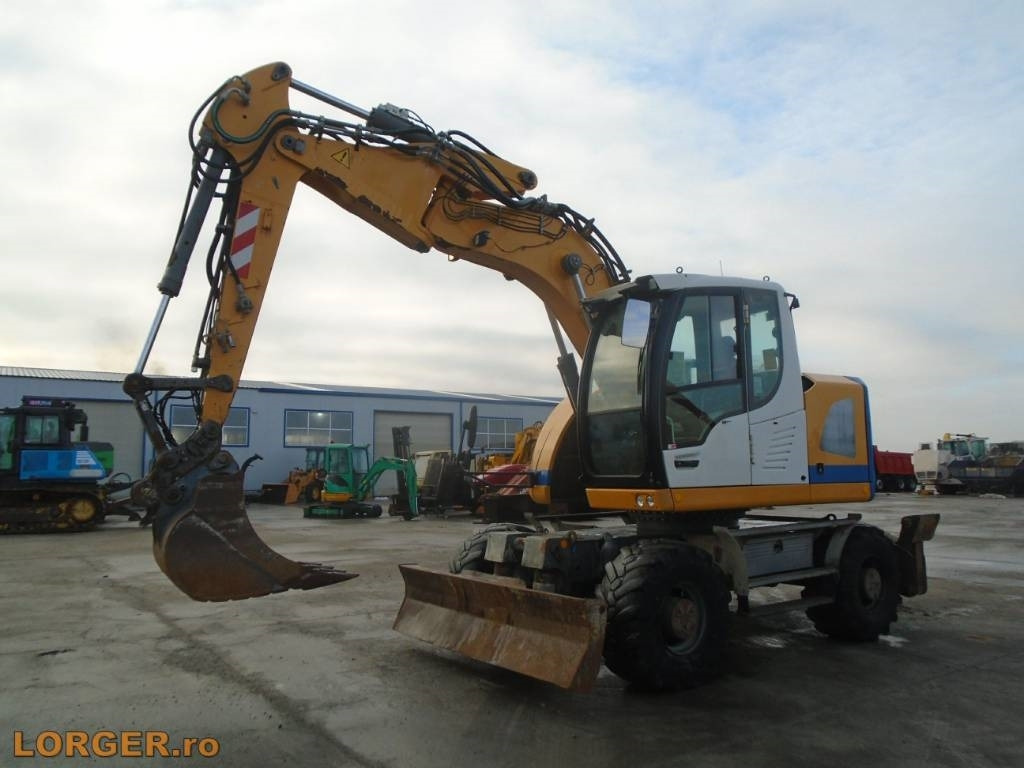 Liebherr A 914 Compact - מחפר גלגלים: תמונה 1 Liebherr A 914 Compact - מחפר גלגלים: תמונה 1