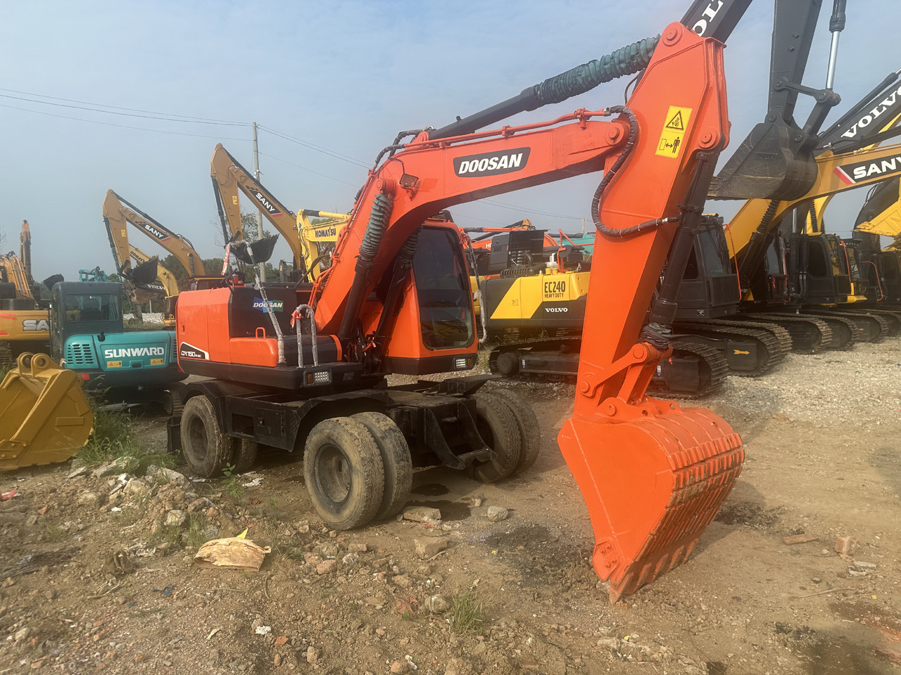 Doosan DX150W-9C - מחפר גלגלים: תמונה 2 Doosan DX150W-9C - מחפר גלגלים: תמונה 2