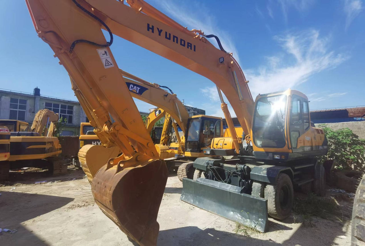 HYUNDAI ROBEX 210W-9 - מחפר גלגלים: תמונה 1 HYUNDAI ROBEX 210W-9 - מחפר גלגלים: תמונה 1