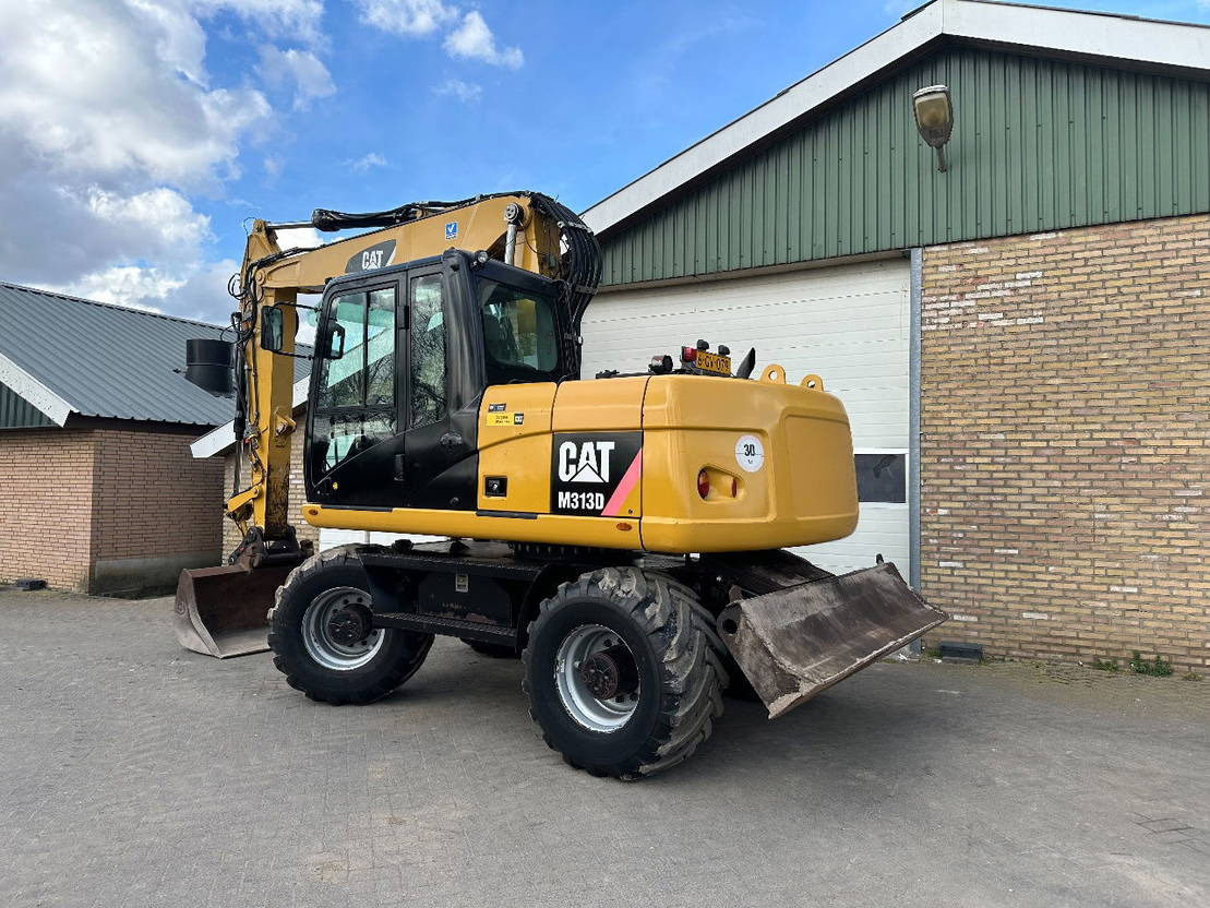 Caterpillar M313D - מחפר גלגלים: תמונה 2 Caterpillar M313D - מחפר גלגלים: תמונה 2
