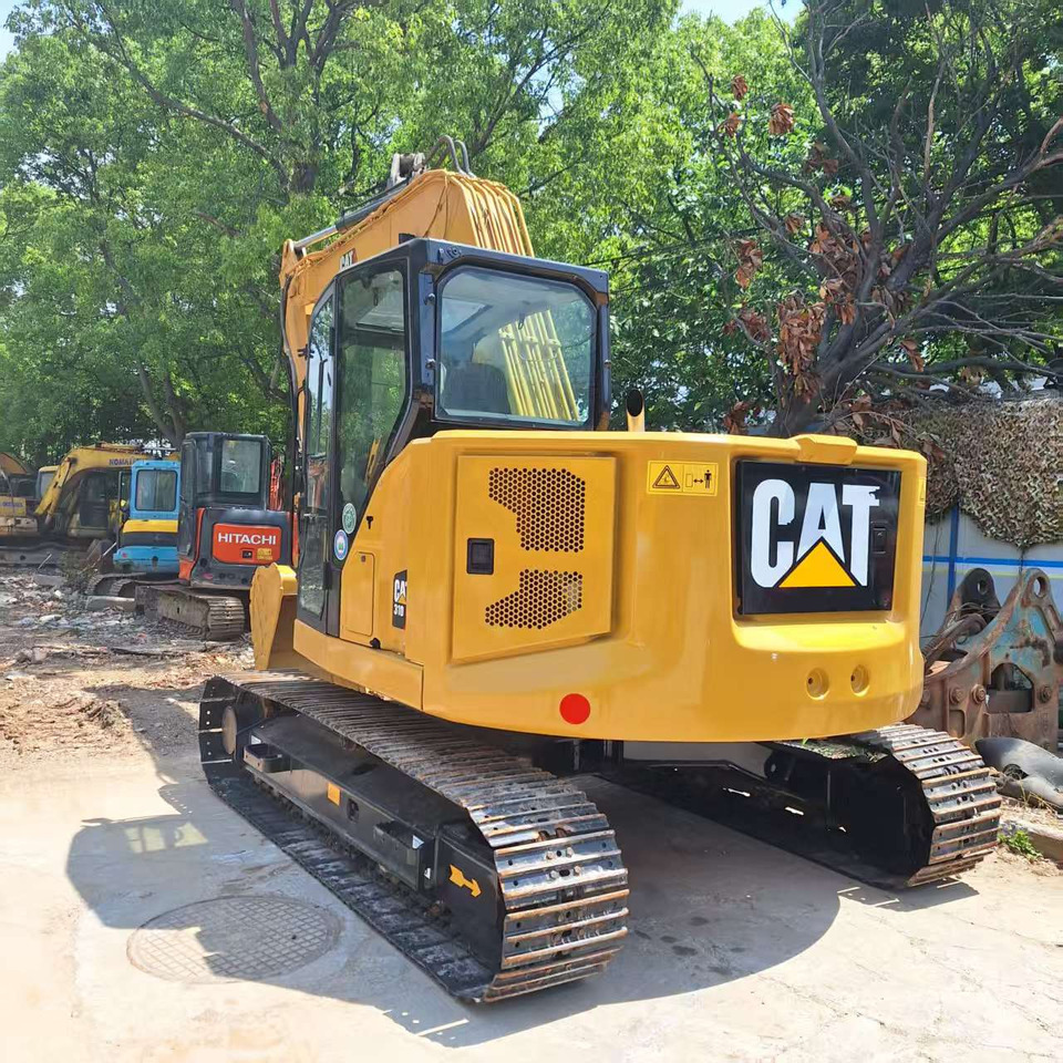 Cat 310 Excavator - מחפר סורק: תמונה 1 Cat 310 Excavator - מחפר סורק: תמונה 1