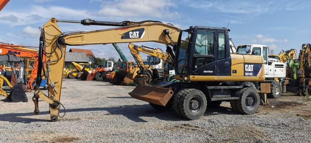 CAT M 315 D - מחפר גלגלים: תמונה 1 CAT M 315 D - מחפר גלגלים: תמונה 1