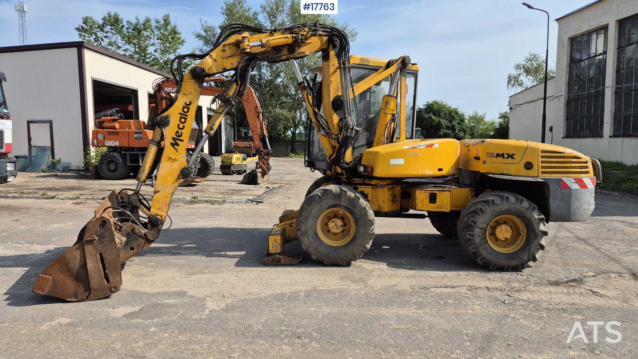 MECALAC 12MX wheeled excavator (1996) - מחפר גלגלים: תמונה 5 MECALAC 12MX wheeled excavator (1996) - מחפר גלגלים: תמונה 5