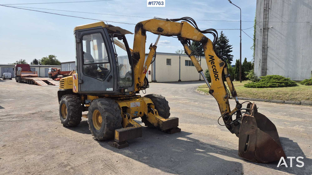 MECALAC 12MX wheeled excavator (1996) - מחפר גלגלים: תמונה 2 MECALAC 12MX wheeled excavator (1996) - מחפר גלגלים: תמונה 2