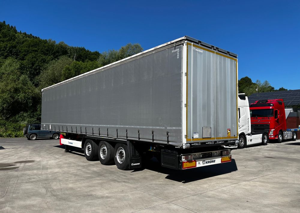 Krone Firanka Coilmulde // 9m // Alu Drzwi // Ażury // Oś podnoszona // - סמיטריילר עם וילונות צד: תמונה 3 Krone Firanka Coilmulde // 9m // Alu Drzwi // Ażury // Oś podnoszona // - סמיטריילר עם וילונות צד: תמונה 3