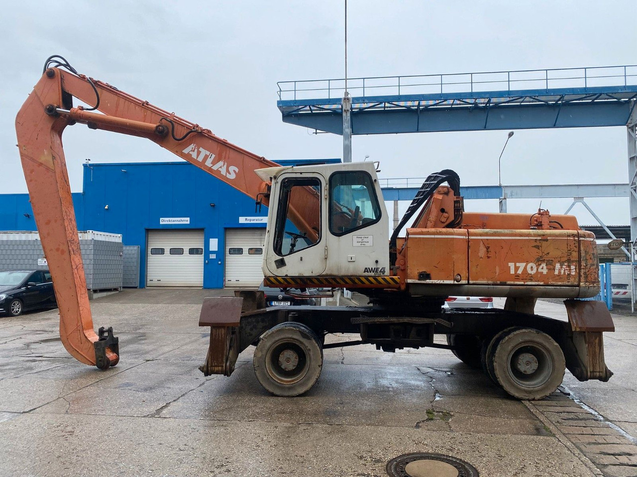 Atlas 1704 MI mit Greifer Umschlagbagger Lang - מחפר גלגלים: תמונה 1 Atlas 1704 MI mit Greifer Umschlagbagger Lang - מחפר גלגלים: תמונה 1