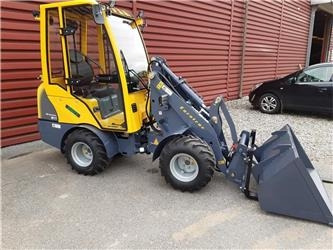 Eurotrac W11 med lang arm, førerhus, skovl og gafler - מעמיס קומפקטי: תמונה 1 Eurotrac W11 med lang arm, førerhus, skovl og gafler - מעמיס קומפקטי: תמונה 1