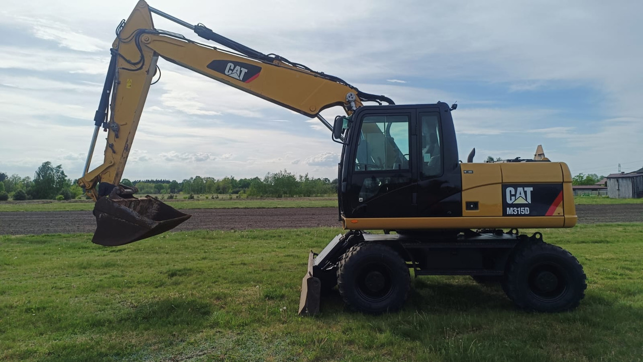 Caterpillar M315D - מחפר סורק: תמונה 1 Caterpillar M315D - מחפר סורק: תמונה 1