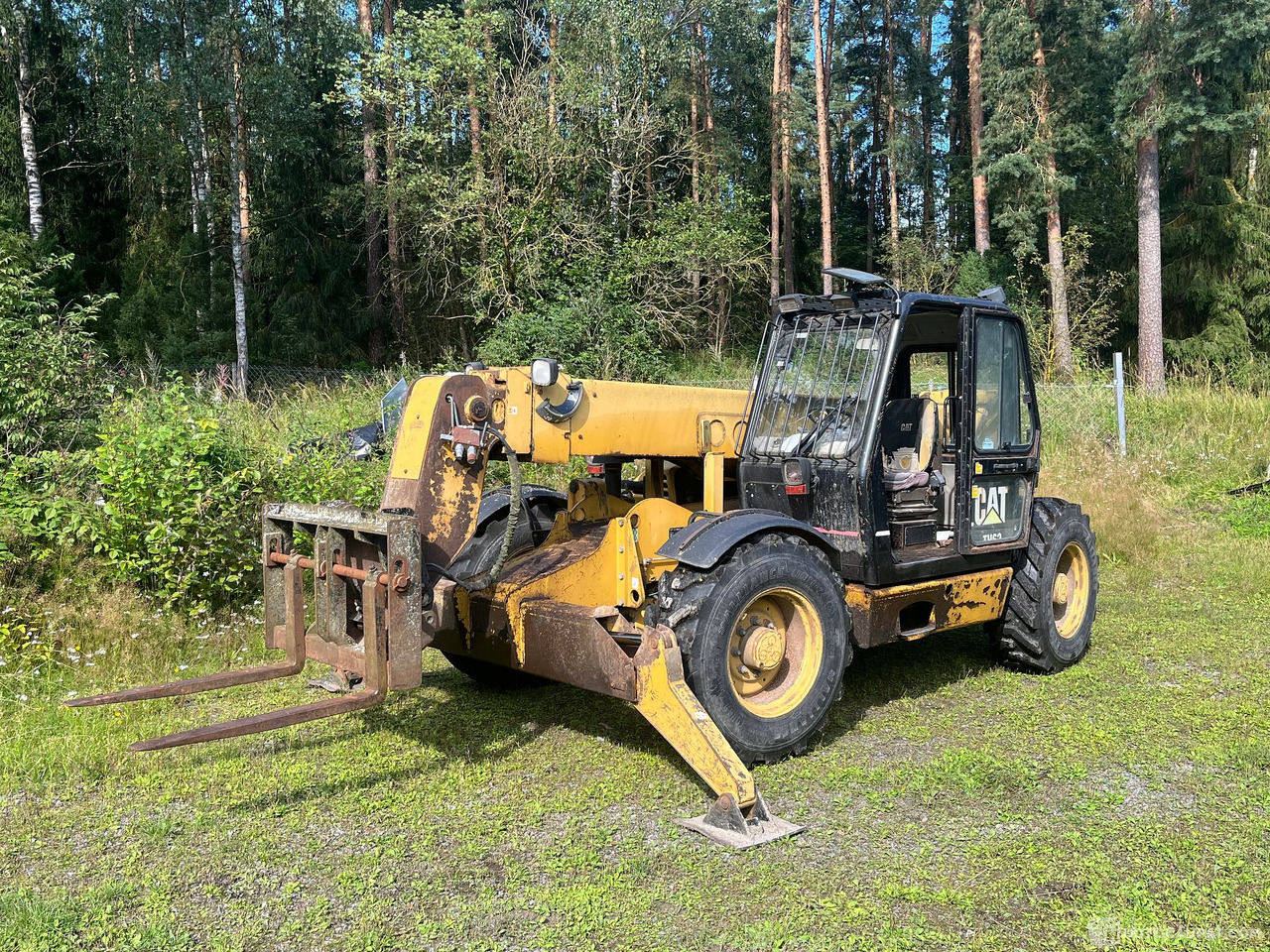 Caterpillar TH63, kurottaja piikeillä ja kauhalla, 2002, Loppi - מכונה חקלאית: תמונה 1 Caterpillar TH63, kurottaja piikeillä ja kauhalla, 2002, Loppi - מכונה חקלאית: תמונה 1