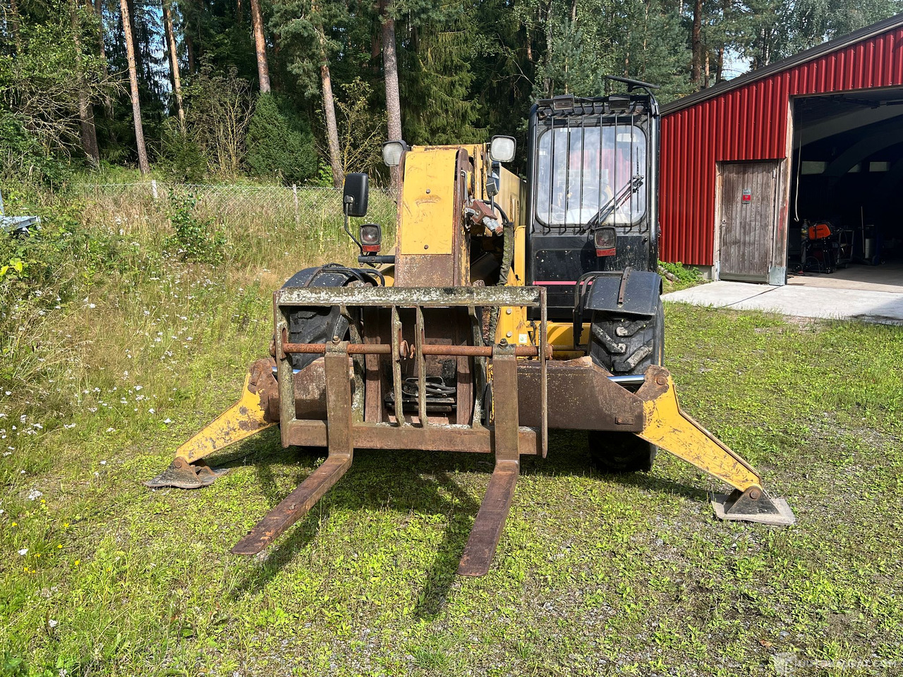 Caterpillar TH63, kurottaja piikeillä ja kauhalla, 2002, Loppi - מכונה חקלאית: תמונה 4 Caterpillar TH63, kurottaja piikeillä ja kauhalla, 2002, Loppi - מכונה חקלאית: תמונה 4