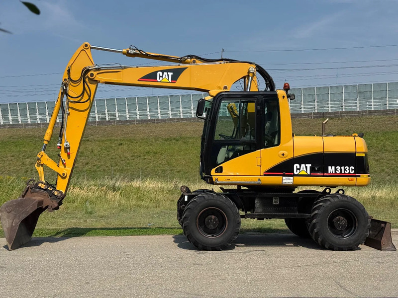 Caterpillar M313C - מחפר גלגלים: תמונה 2 Caterpillar M313C - מחפר גלגלים: תמונה 2